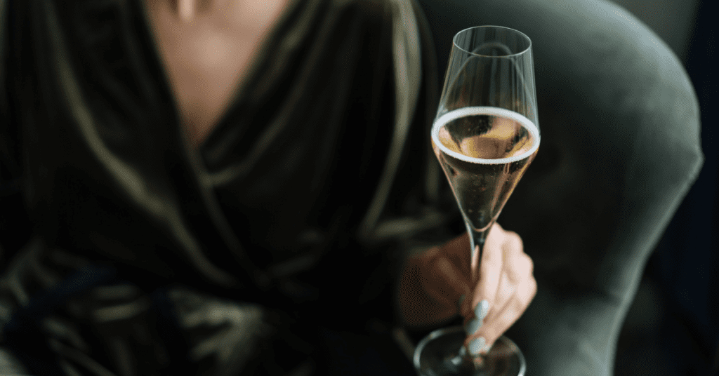 woman holding champagne glass